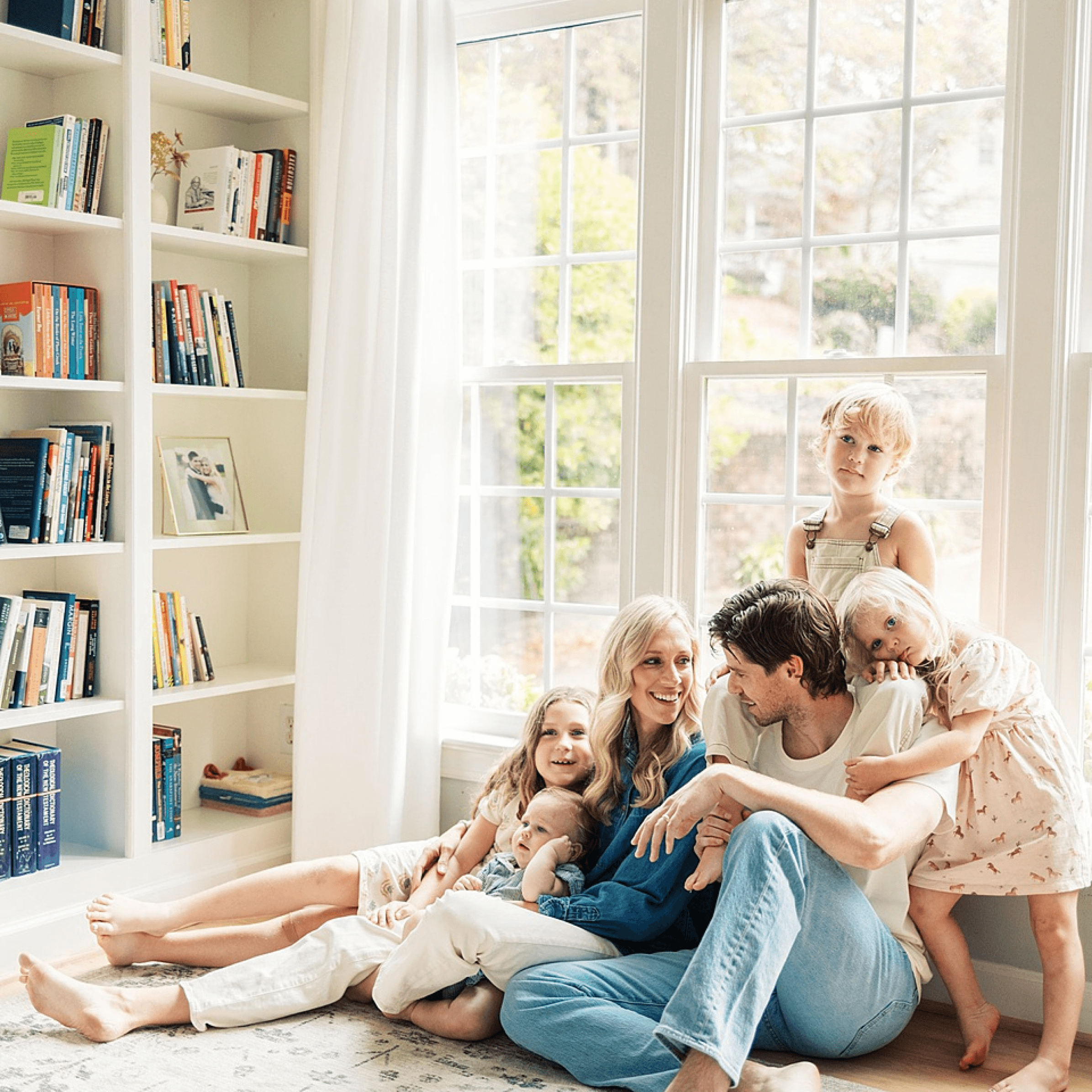A family relaxing together at home while MYLO handles their move